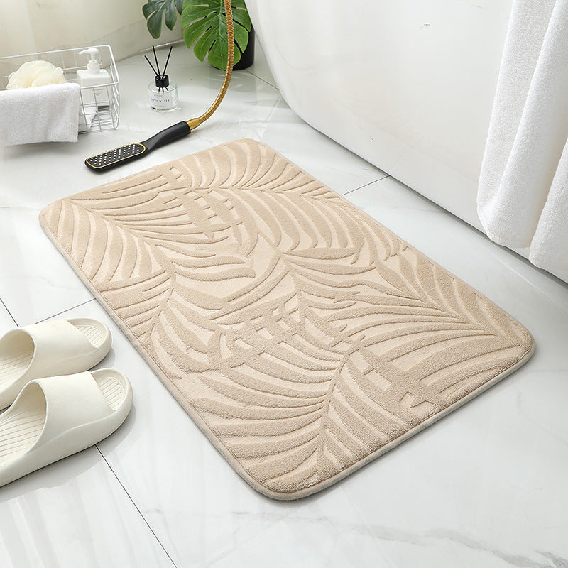 Tapis de sol absorbant antidérapant et moderne en éponge pour porte de salle de bain minimaliste.
