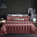 Ensemble de literie quatre pièces style hôtel, en coton à fibres longues (100s), coloris uni, comprenant une housse de couette et un drap-housse.