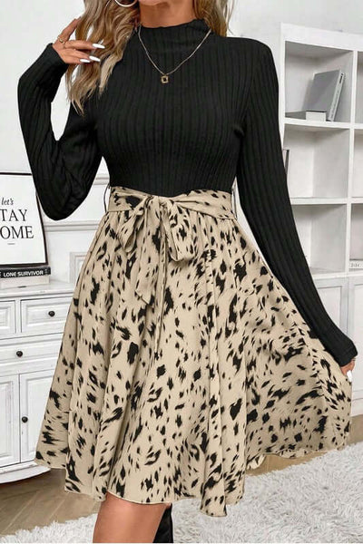 Ribbed Knit Patchwork Printed Belted A-line Dress featuring a ribbed bodice and a patterned skirt.