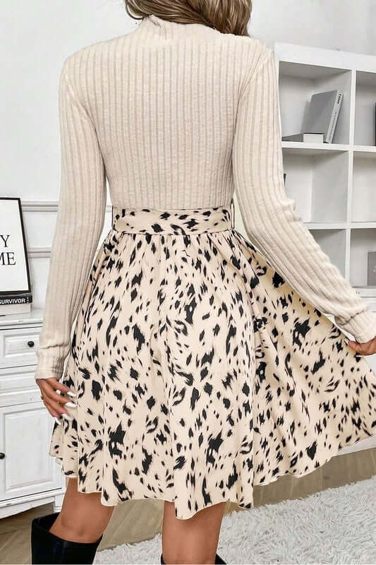 Ribbed Knit Patchwork Printed Belted A-line Dress worn from the back, showcasing its stylish design and playful print.
