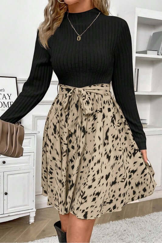 Ribbed Knit Patchwork Printed Belted A-line Dress showcasing a black ribbed top and a spotted beige skirt.