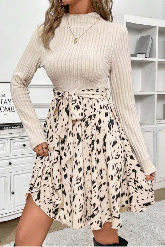 Ribbed Knit Patchwork Printed Belted A-line Dress with long sleeves and playful skirt design.