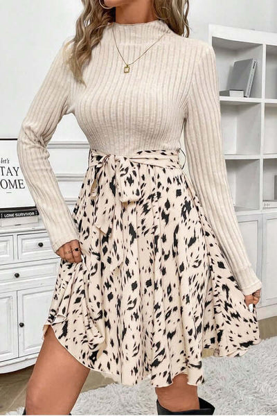 Ribbed Knit Patchwork Printed Belted A-line Dress with long sleeves and playful skirt design.