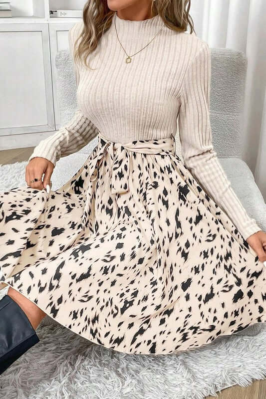 Ribbed Knit Patchwork Printed Belted A-line Dress featuring a textured top and printed skirt design.