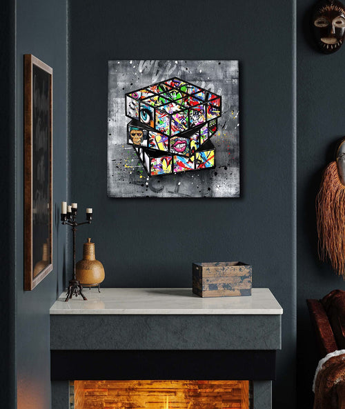 Pintura em tela de Banksy com grafite de um cubo de Rubik na parede