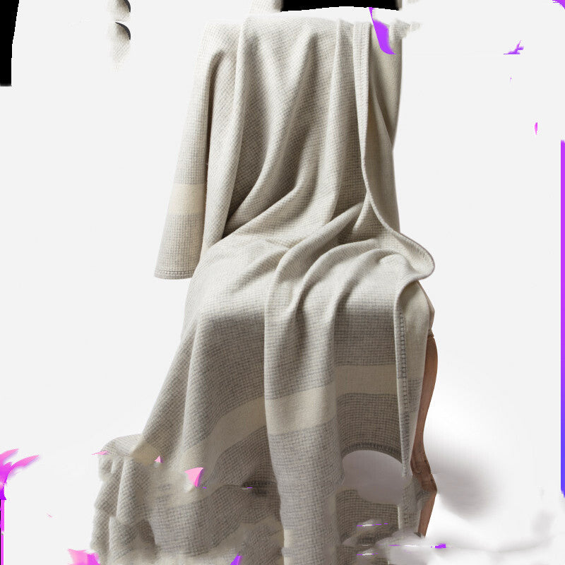 Manta de lã com estampado de mil pássaros, ideal para dormitar no sofá ou no escritório com ar condicionado.