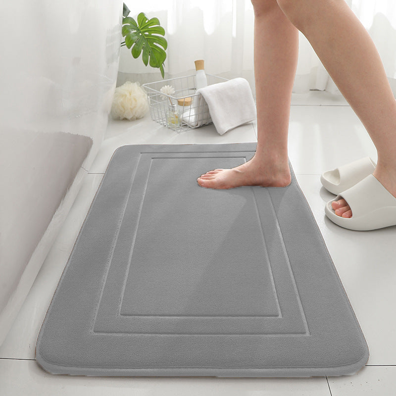 Tapis de sol absorbant antidérapant et moderne en éponge pour porte de salle de bain minimaliste.
