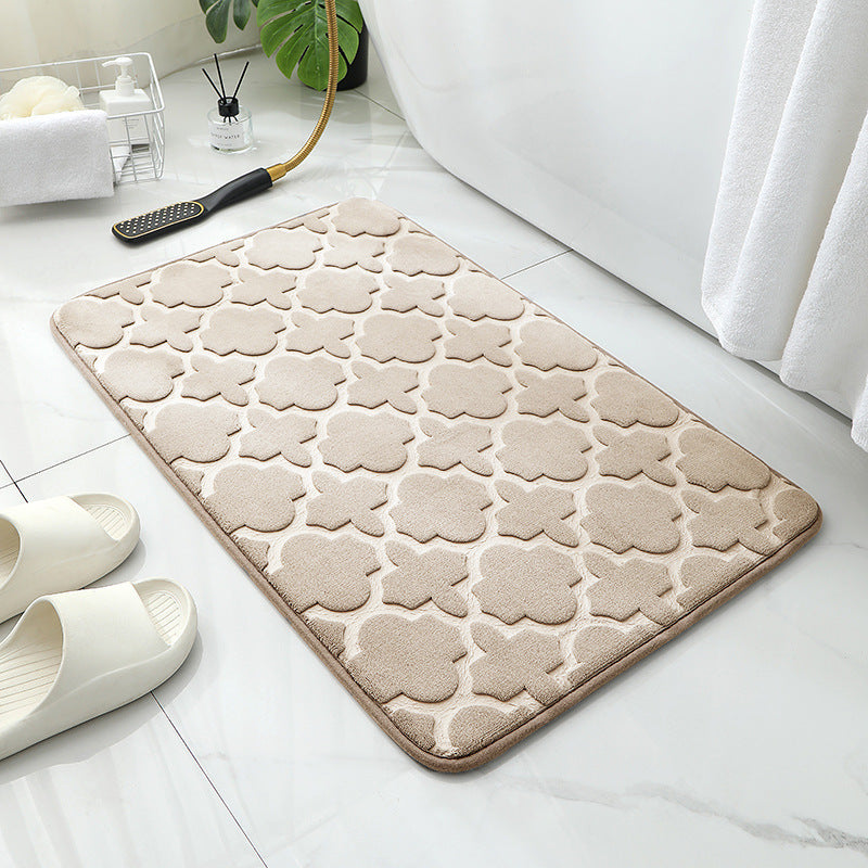 Tapis de sol absorbant antidérapant et moderne en éponge pour porte de salle de bain minimaliste.
