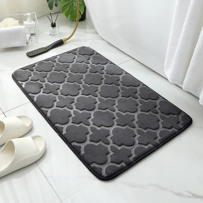 Tapis de sol absorbant antidérapant et moderne en éponge pour porte de salle de bain minimaliste.