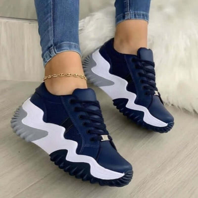 Summer Women's Sneakers Thick Bottom Canvas Casual Shoes in navy blue and white worn with jeans.