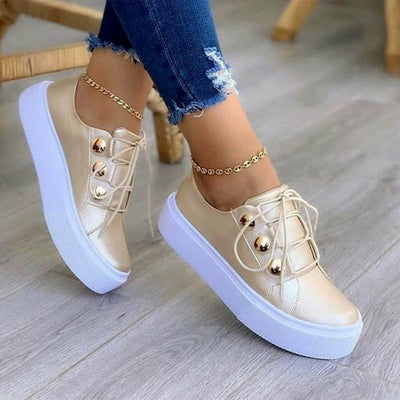 Light Breathable Female Running Shoes Casual Women Sneakers in gold and white, stylish design with laces and platform sole.