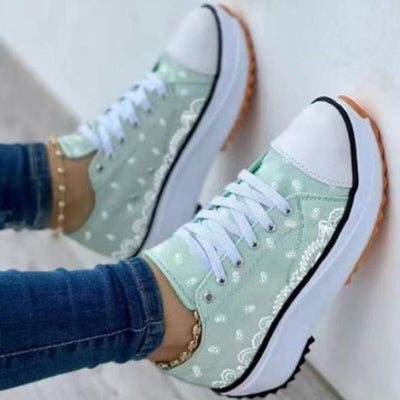 Pattern Canvas Women Sneakers Casual Sport Shoes in mint green worn with casual jeans.