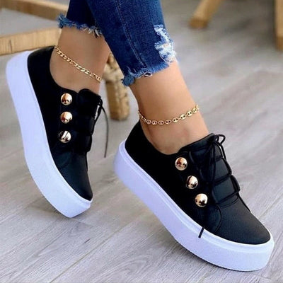 Light Breathable Female Running Shoes Casual Women Sneakers in black with stylish gold buttons and platform sole.