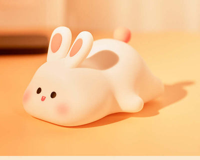 🐰 Soft Silicone Bunny Night Light – Touch-Control Lamp for Kids’ Rooms & Gifts displayed on a warm surface.