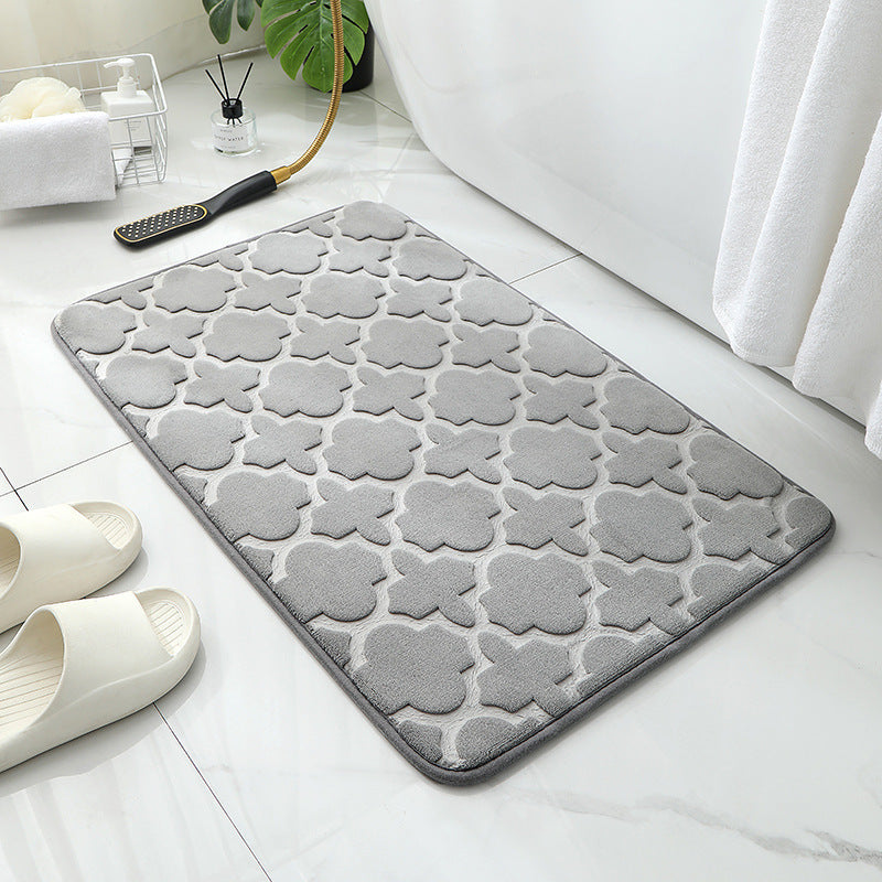 Tapis de sol absorbant antidérapant et moderne en éponge pour porte de salle de bain minimaliste.