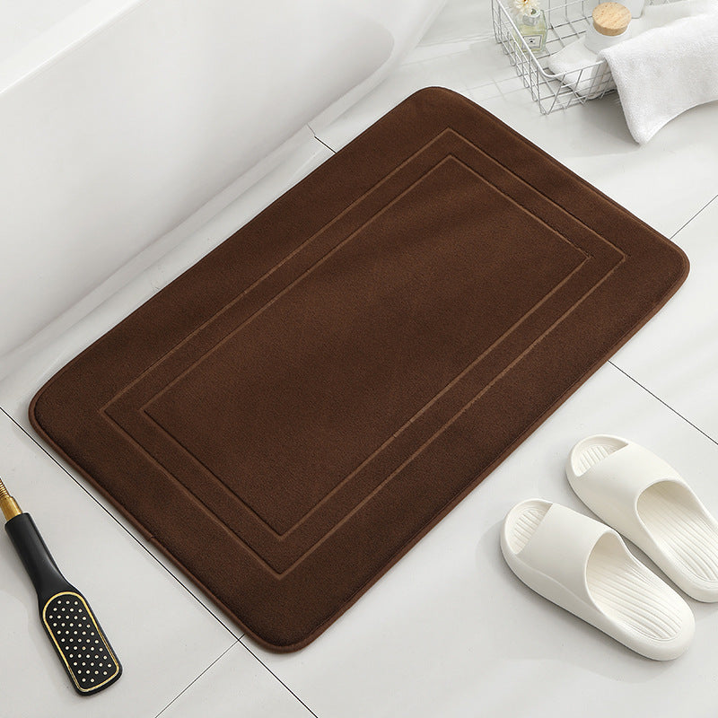 Tapis de sol absorbant antidérapant et moderne en éponge pour porte de salle de bain minimaliste.