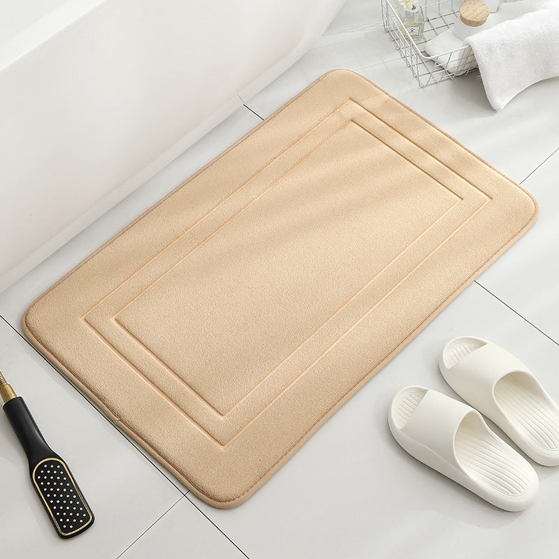 Tapis de sol absorbant antidérapant et moderne en éponge pour porte de salle de bain minimaliste.