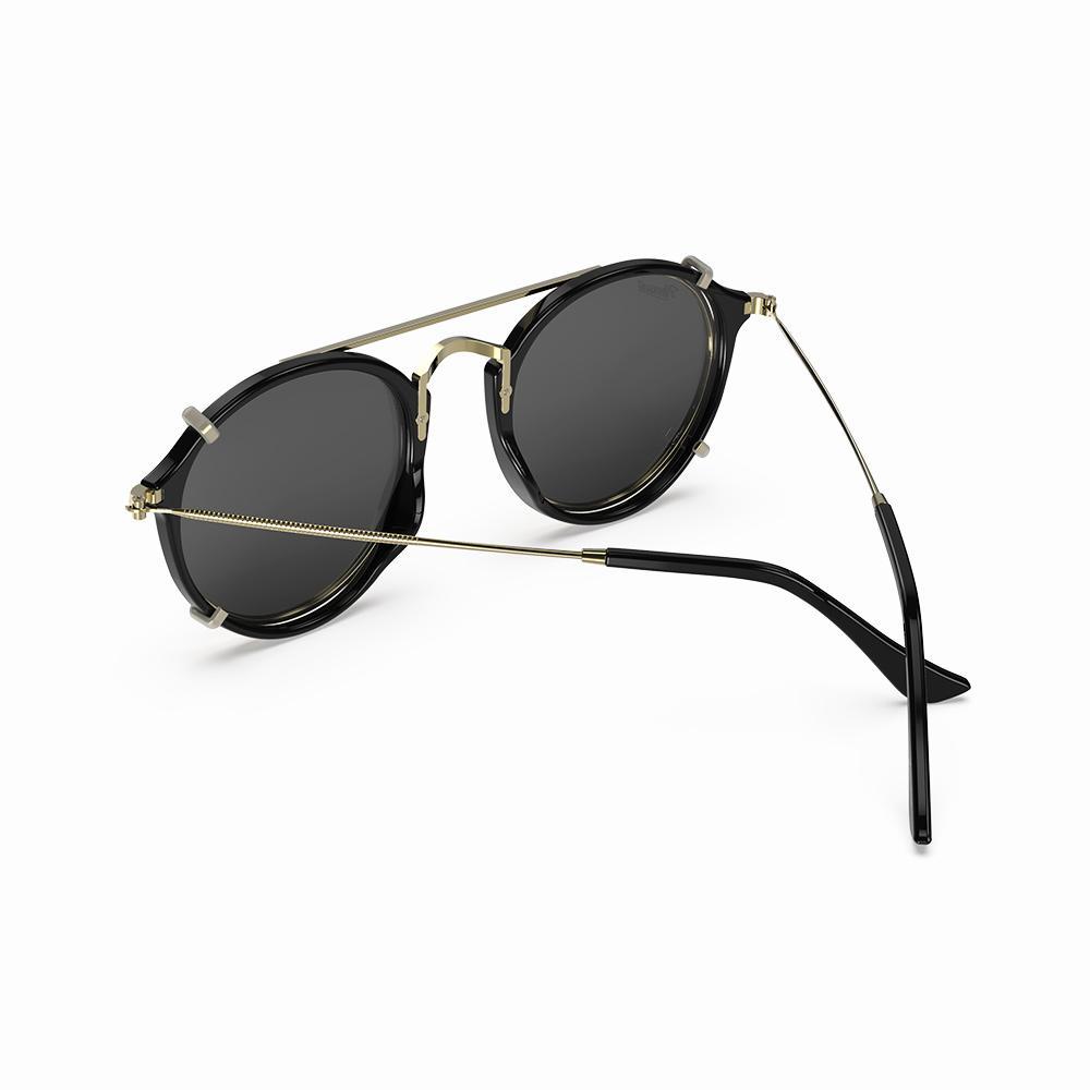 Vintage Heritage Clip-on sunglasses in black with a gold frame and dark lenses, showcasing a stylish vintage design.