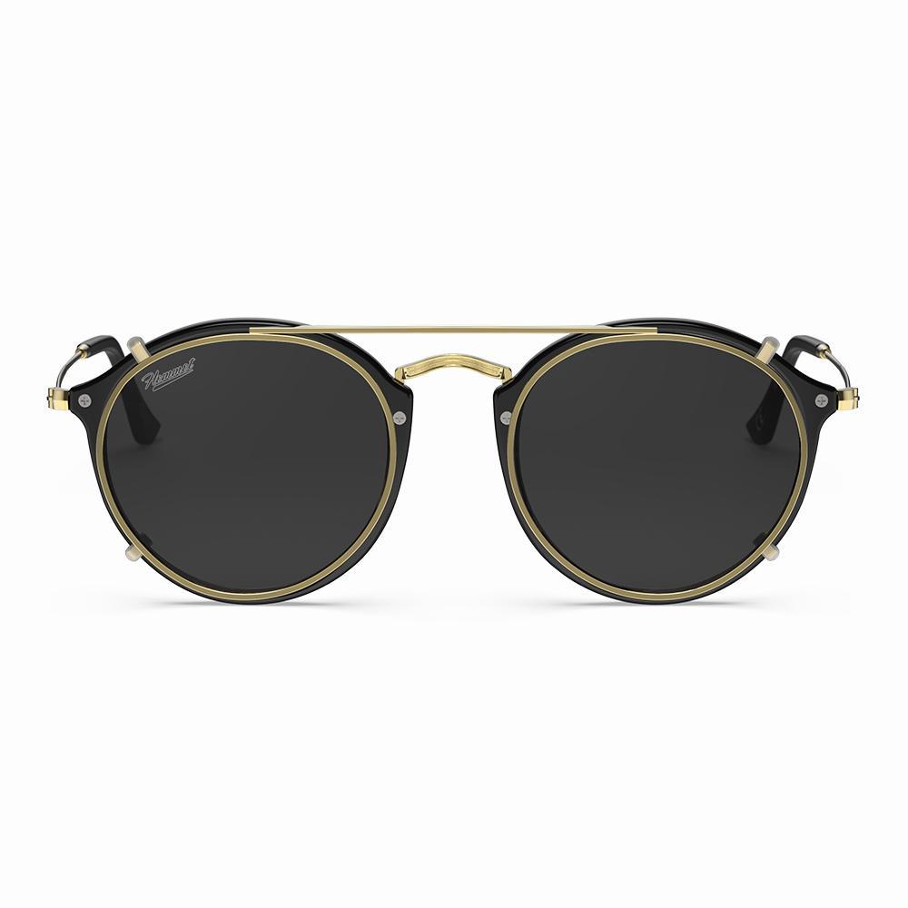 Vintage Heritage Clip-on sunglasses with black lenses and gold accents, featuring a stylish round frame.