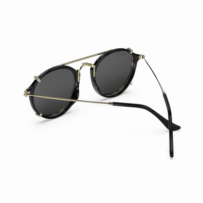 Vintage Heritage Clip-on sunglasses featuring a sleek black design with gold accents.