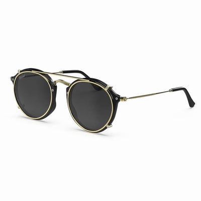 Vintage Heritage Clip-on sunglasses featuring a lightweight design with black and gold accents.